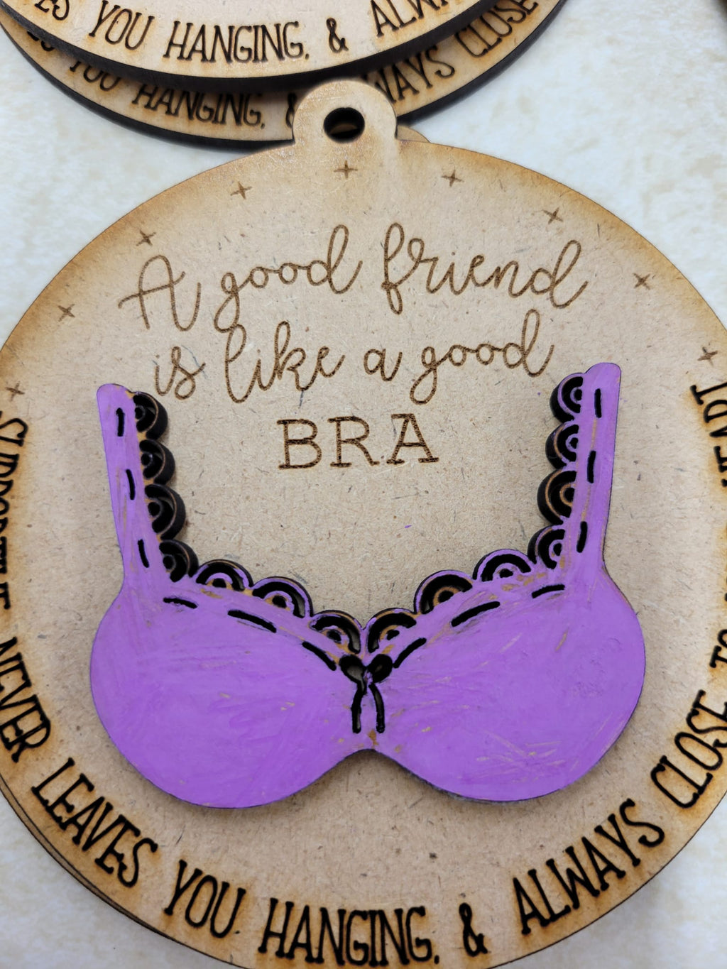 A good friend is like a good bra ornament
