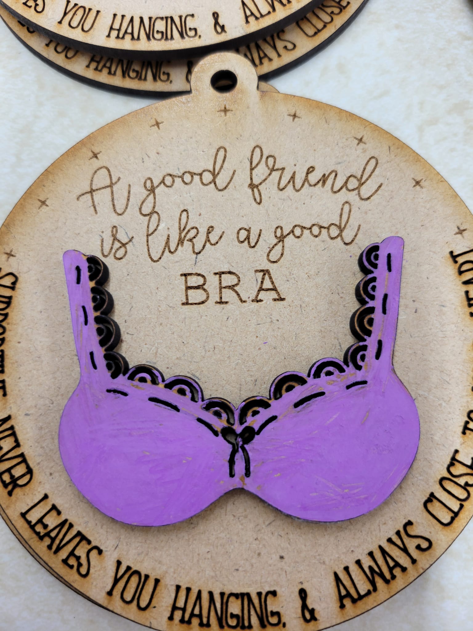 A good friend is like a good bra ornament