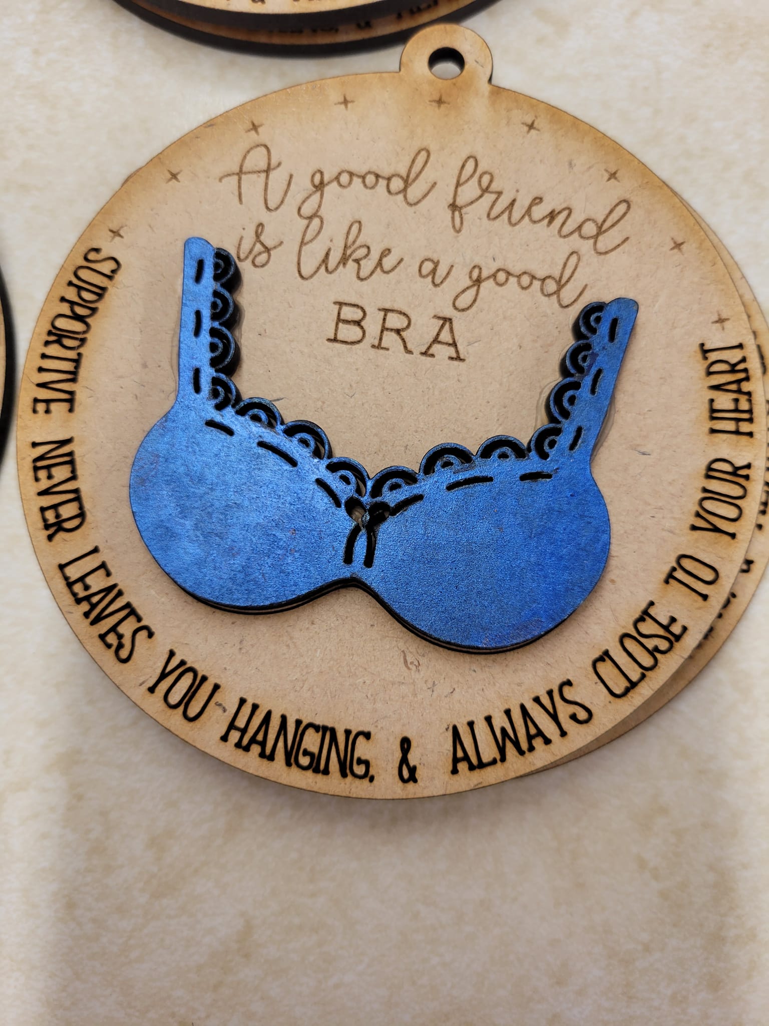 A good friend is like a good bra ornament