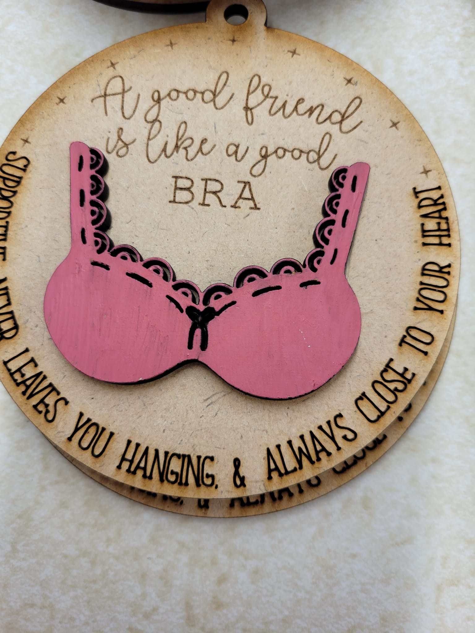 A good friend is like a good bra ornament